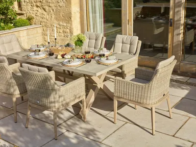 Bramblecrest Monterey Sandstone Ceramic Rectangle Dining Set with 6 Rattan Vogue Armchairs - image 1